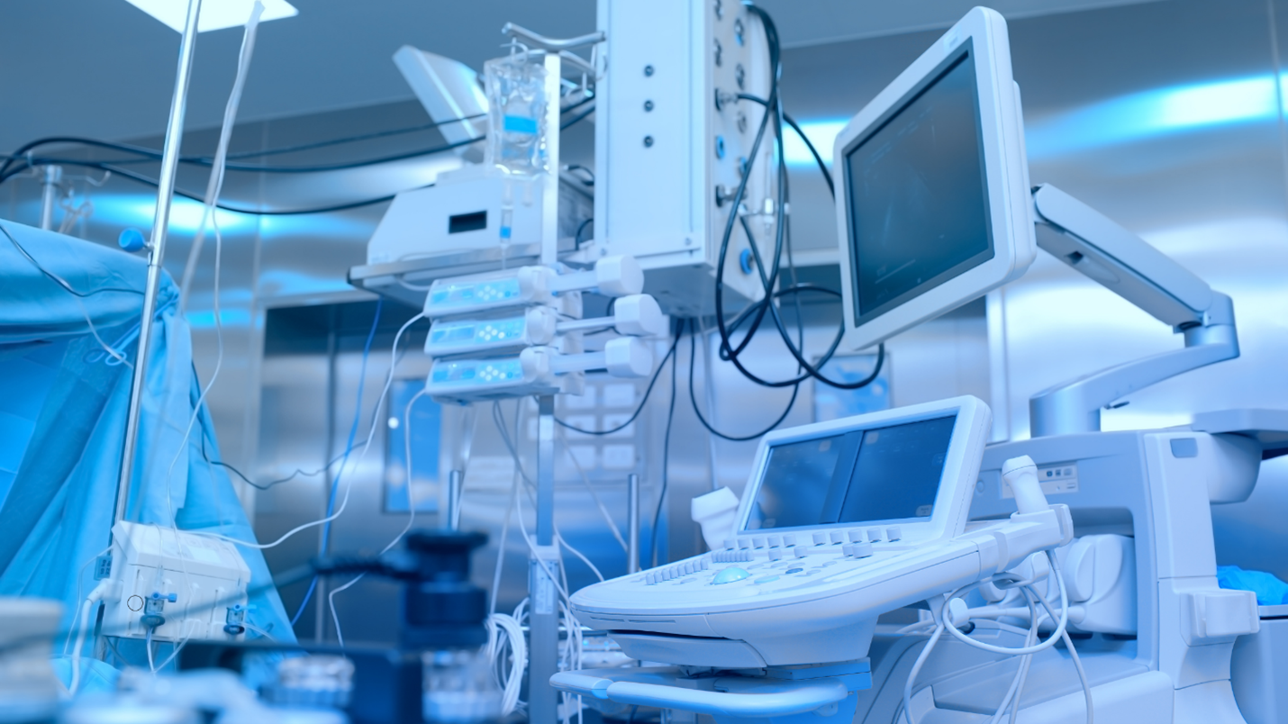 A hospital room with medical equipment and a monitor displaying vital signs. How x team motors used in medical equipment