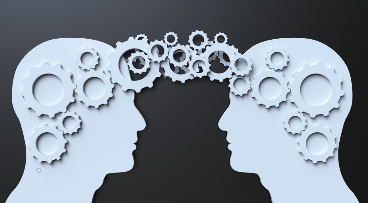 Two individuals with gears in their heads, symbolizing teamwork and collaboration in problem-solving.