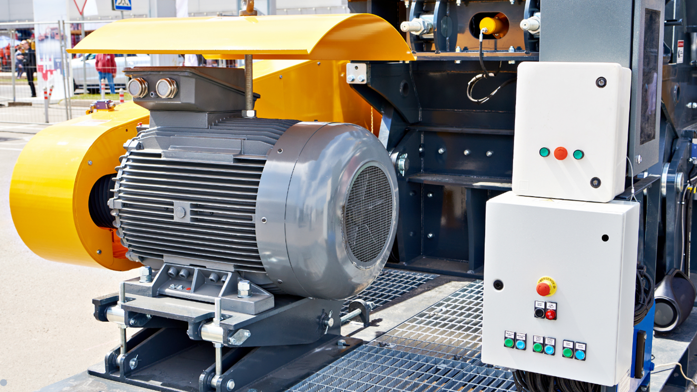A close-up of a motor with a yellow cover.