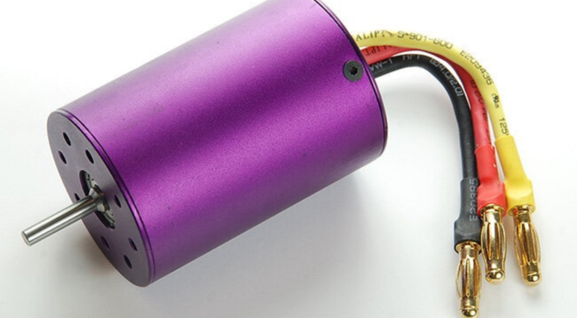 High-performance brushless motor in purple with yellow wire. Blog Image