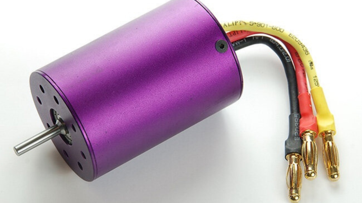 High-performance brushless motor in purple with yellow wire. Blog Image