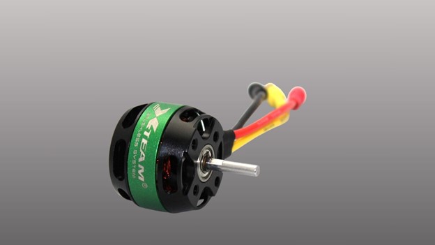 A green and black X team servo motor featuring a prominent red wire, showcasing its distinct color combination and design