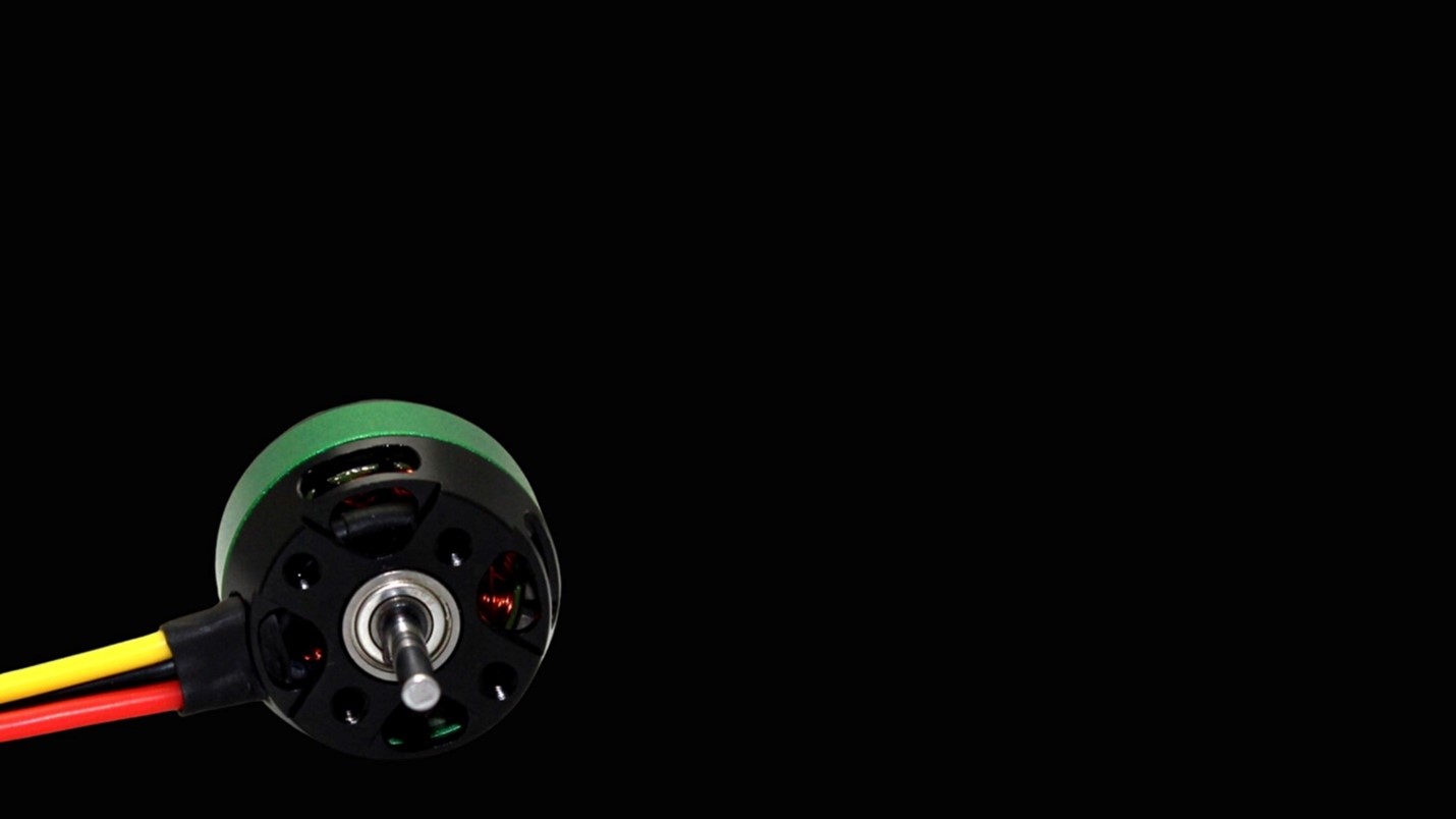 Close up view of X team Green and black EC Motor in black background